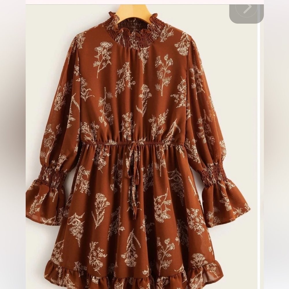 Ladies dress, size 1x, Rust Brown with light peach designs, knee length on 5’2